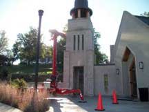Shows and Aerial Work Platform with safety cones surrounding it
